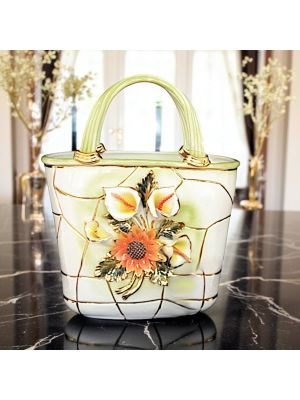 Tasche, Tischdekoration aus Keramik, geschmückt mit Blumen und goldenen Details, handgefertigt.